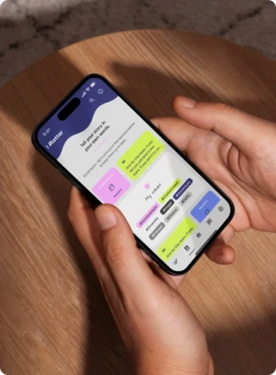 Hands holding iPhone 15 on wooden table displaying mobile app interface